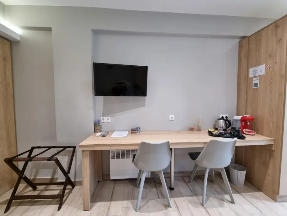 Bench with 2 chairs, tea kettle and coffee maker